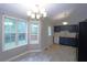 Eat-in kitchen with stainless appliances and deck access at 301 Thorn Thicket Dr, Rockmart, GA 30153