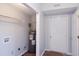 The utility room includes a water heater, a wire shelf, and a door at 301 Thorn Thicket Dr, Rockmart, GA 30153