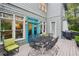 Back deck perfect for outdoor dining with furniture, grill, and a view of the private yard at 135 High Point Walk, Atlanta, GA 30342