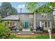 Backyard of a two-story home with a large deck and blue door at 135 High Point Walk, Atlanta, GA 30342