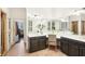 This bathroom includes a long vanity with double sinks, a make up area, and tiled floors at 135 High Point Walk, Atlanta, GA 30342