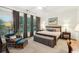 Serene bedroom with large windows, neutral decor, and a comfortable seating area at 135 High Point Walk, Atlanta, GA 30342