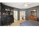 This bedroom has an attached office space with built in desk, shelving and storage at 135 High Point Walk, Atlanta, GA 30342