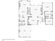First floor plan of a house showing the living room, kitchen, dining room, garage and primary bedroom at 135 High Point Walk, Atlanta, GA 30342