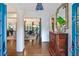Elegant foyer featuring hardwood floors, a decorative mirror, and a glimpse into the living room at 135 High Point Walk, Atlanta, GA 30342