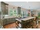 Bright kitchen with natural light, modern appliances, white countertops, and a view to the living area at 135 High Point Walk, Atlanta, GA 30342
