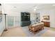 Bright living room with large windows, a ceiling fan, built in shelves, and comfortable furniture at 135 High Point Walk, Atlanta, GA 30342