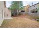 View of the backyard with a small patio and a wooden fence separating the houses at 1498 Scenic Pines Dr, Lawrenceville, GA 30044