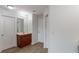 Bathroom featuring a wooden vanity, mirror, and bright lighting at 1498 Scenic Pines Dr, Lawrenceville, GA 30044