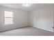 Bedroom with neutral carpet and a window at 1498 Scenic Pines Dr, Lawrenceville, GA 30044
