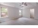 Bright Primary bedroom with carpet, ceiling fan, and natural light at 1498 Scenic Pines Dr, Lawrenceville, GA 30044