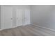 Bedroom with carpet, neutral walls, and three closets at 1498 Scenic Pines Dr, Lawrenceville, GA 30044
