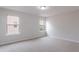 Bedroom with neutral carpet and two windows at 1498 Scenic Pines Dr, Lawrenceville, GA 30044