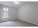 Bedroom with carpet, neutral walls, and a window at 1498 Scenic Pines Dr, Lawrenceville, GA 30044
