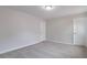 Bedroom with neutral carpet and two doors at 1498 Scenic Pines Dr, Lawrenceville, GA 30044