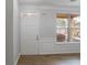 Bright entryway with a front door, window, wainscotting and wood-look flooring at 1498 Scenic Pines Dr, Lawrenceville, GA 30044