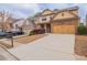 Two-story home with stone accents, two-car garage, driveway, and manicured landscaping at 1498 Scenic Pines Dr, Lawrenceville, GA 30044