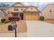 Two-story home featuring attached two-car garage, concrete driveway, and lovely landscaping at 1498 Scenic Pines Dr, Lawrenceville, GA 30044