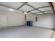 Spacious two-car garage with white walls and an open door at 1498 Scenic Pines Dr, Lawrenceville, GA 30044