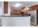 Well-lit kitchen featuring stainless steel appliances and ample cabinet space at 1498 Scenic Pines Dr, Lawrenceville, GA 30044