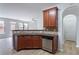 Kitchen area with a sink, stainless steel dishwasher, and view to the living room at 1498 Scenic Pines Dr, Lawrenceville, GA 30044