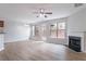 Bright living room with natural light, fireplace, and hardwood floors at 1498 Scenic Pines Dr, Lawrenceville, GA 30044