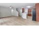 Open-concept living area with hardwood floors and kitchen view at 1498 Scenic Pines Dr, Lawrenceville, GA 30044
