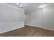 Bright living room area with wainscotting, light-colored walls, and wood-look floors at 1498 Scenic Pines Dr, Lawrenceville, GA 30044
