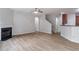 Spacious living room with modern fireplace and hardwood floors at 1498 Scenic Pines Dr, Lawrenceville, GA 30044
