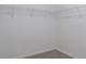 Walk-in closet with white wire shelving and neutral carpet at 1498 Scenic Pines Dr, Lawrenceville, GA 30044