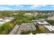 Stunning aerial view showcasing the community, mature trees, and the city skyline in the distance at 1741 Liberty Nw Pkwy, Atlanta, GA 30318