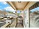 Relax on this cozy balcony with views of the neighborhood and fresh air streaming in through the sliding glass doors at 1741 Liberty Nw Pkwy, Atlanta, GA 30318