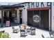 Outdoor patio at Fox Bros. Bar-B-Q with shaded seating, games, and a relaxed atmosphere at 1741 Liberty Nw Pkwy, Atlanta, GA 30318