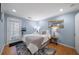 Bright bedroom with hardwood floors, cozy furnishings, and a charming mirror and wall decor at 1741 Liberty Nw Pkwy, Atlanta, GA 30318