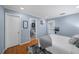 Bright bedroom with hardwood floors, cozy furnishings, and access to an ensuite bathroom at 1741 Liberty Nw Pkwy, Atlanta, GA 30318