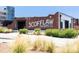 Exterior view of Scofflaw Brewing Co. featuring brick facade and a patio area, set against a clear blue sky at 1741 Liberty Nw Pkwy, Atlanta, GA 30318