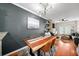 Dining area with natural wood table, modern art, and living room view at 1741 Liberty Nw Pkwy, Atlanta, GA 30318