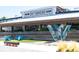 Chattahoochee Works exterior with artistic 'W' feature and colorful seating at 1741 Liberty Nw Pkwy, Atlanta, GA 30318
