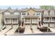 Townhome exterior showcases well-maintained facades, garages, and landscaping at 1741 Liberty Nw Pkwy, Atlanta, GA 30318