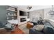 Comfortable living room with fireplace, TV, hardwood floor, stylish furniture and decor at 1741 Liberty Nw Pkwy, Atlanta, GA 30318