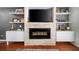 Living room with fireplace, built-in shelving, and flatscreen TV at 1741 Liberty Nw Pkwy, Atlanta, GA 30318