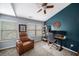 Inviting home office with accent wall, fan, functional layout, and comfortable leather chair at 1741 Liberty Nw Pkwy, Atlanta, GA 30318