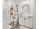 This elegant bathroom features a glass shower, designer tile floor, and white vanity with black hardware at 2200 Cortland Rd, Milton, GA 30009