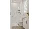 The bathroom features a glass shower, white vanity with black hardware, and geometric patterned tile floors at 2200 Cortland Rd, Milton, GA 30009