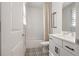 This bathroom features a shower with white subway tile, patterned tile flooring, and sleek white vanity at 2200 Cortland Rd, Milton, GA 30009