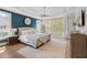 Bright bedroom with hardwood floors, large windows, and a plush rug at 2200 Cortland Rd, Milton, GA 30009
