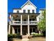 Charming two-story home featuring a welcoming front porch and a mix of modern white siding and brick accents at 2200 Cortland Rd, Milton, GA 30009