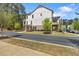 Newly built townhouse with a porch and balcony, featuring brick accents at 2200 Cortland Rd, Milton, GA 30009