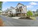 Stylish townhomes with charming porches and manicured landscaping, offering a modern and inviting curb appeal at 2200 Cortland Rd, Milton, GA 30009