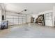 Spacious garage with epoxy flooring and ample storage space, perfect for car enthusiasts or hobbyists at 2200 Cortland Rd, Milton, GA 30009